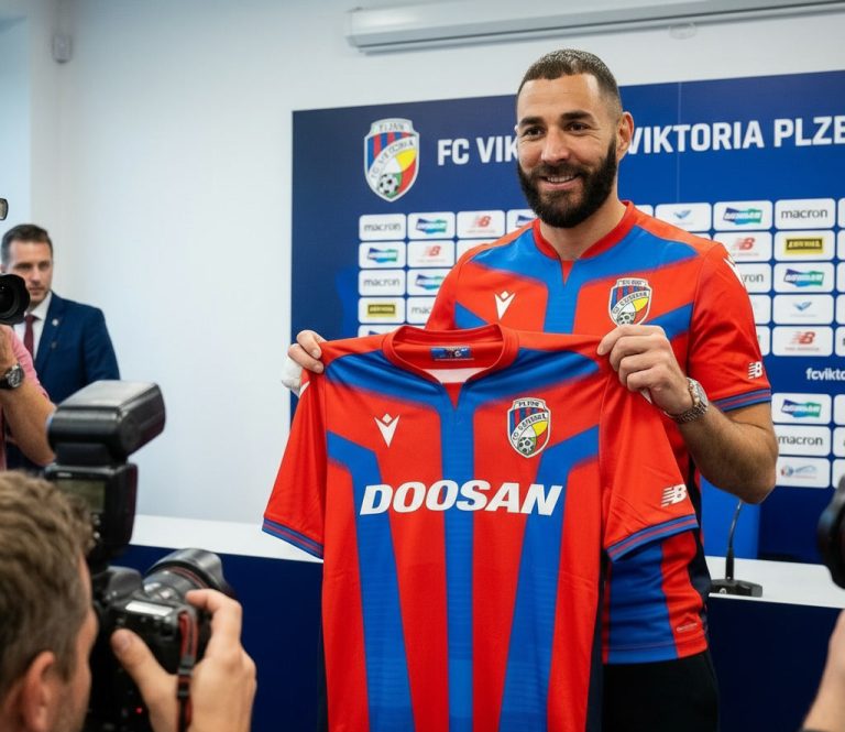 gemini-2.5-flash-image_create_an_image_of_Karim_Benzema_wearing_and_holding_the_jersey_of_fc_viktoria_p-0 (1)