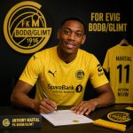 gpt-image-2_creare_an_image_of_Anthony_Martial_signing_a_contract_and_wearing_the_jersey_of_-0